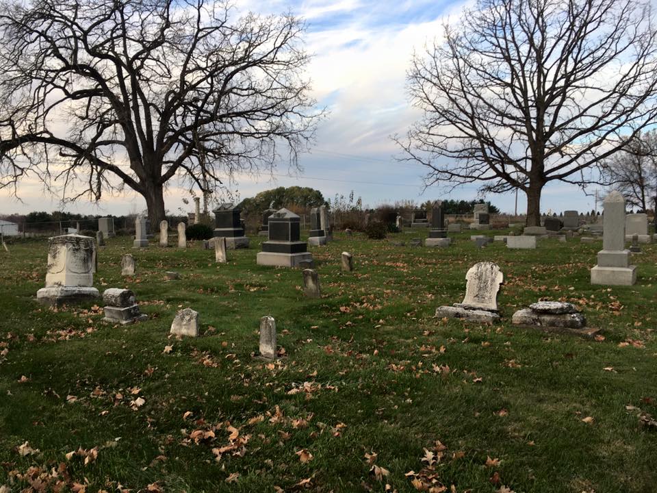 Cemetery grounds in autumn with dramatic prairie sky