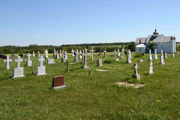 Cemetery with white crosses and small chapel